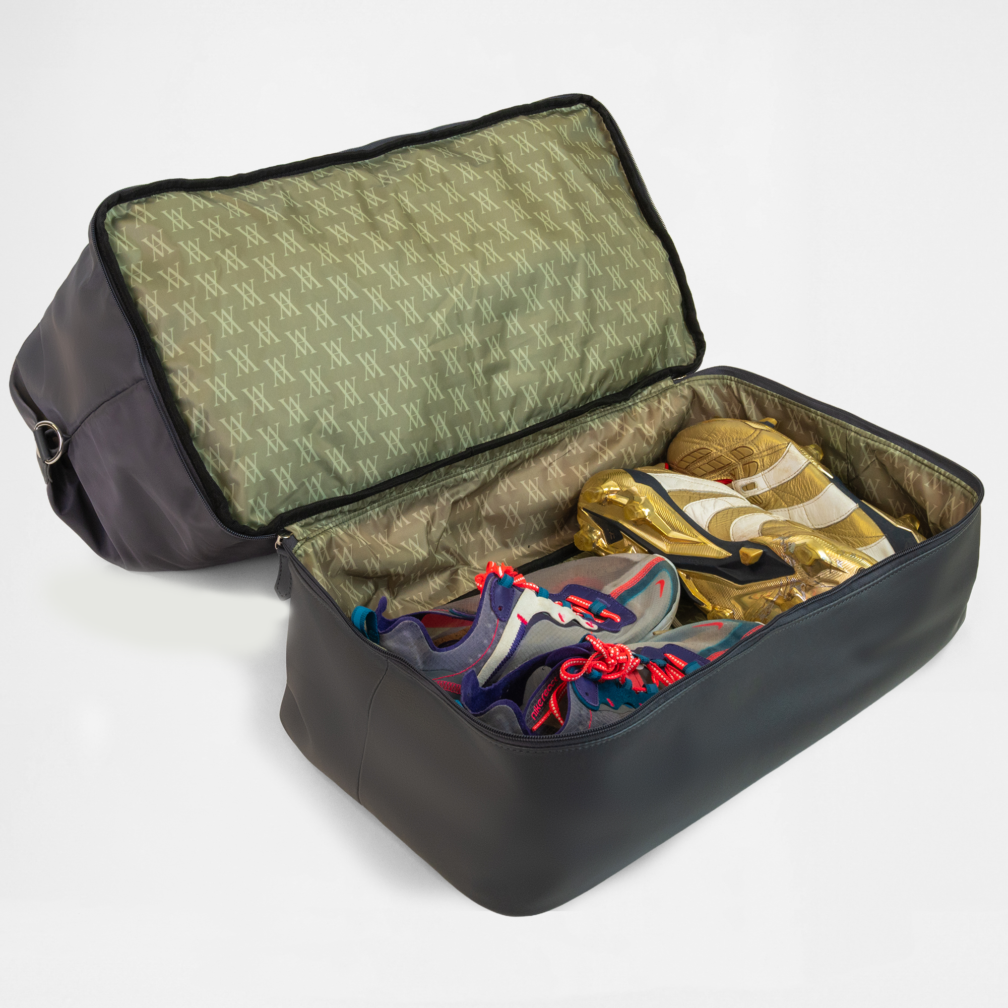 Open shoe compartment of the Athens Gym Bag in Graphite, storing trainers and footwear