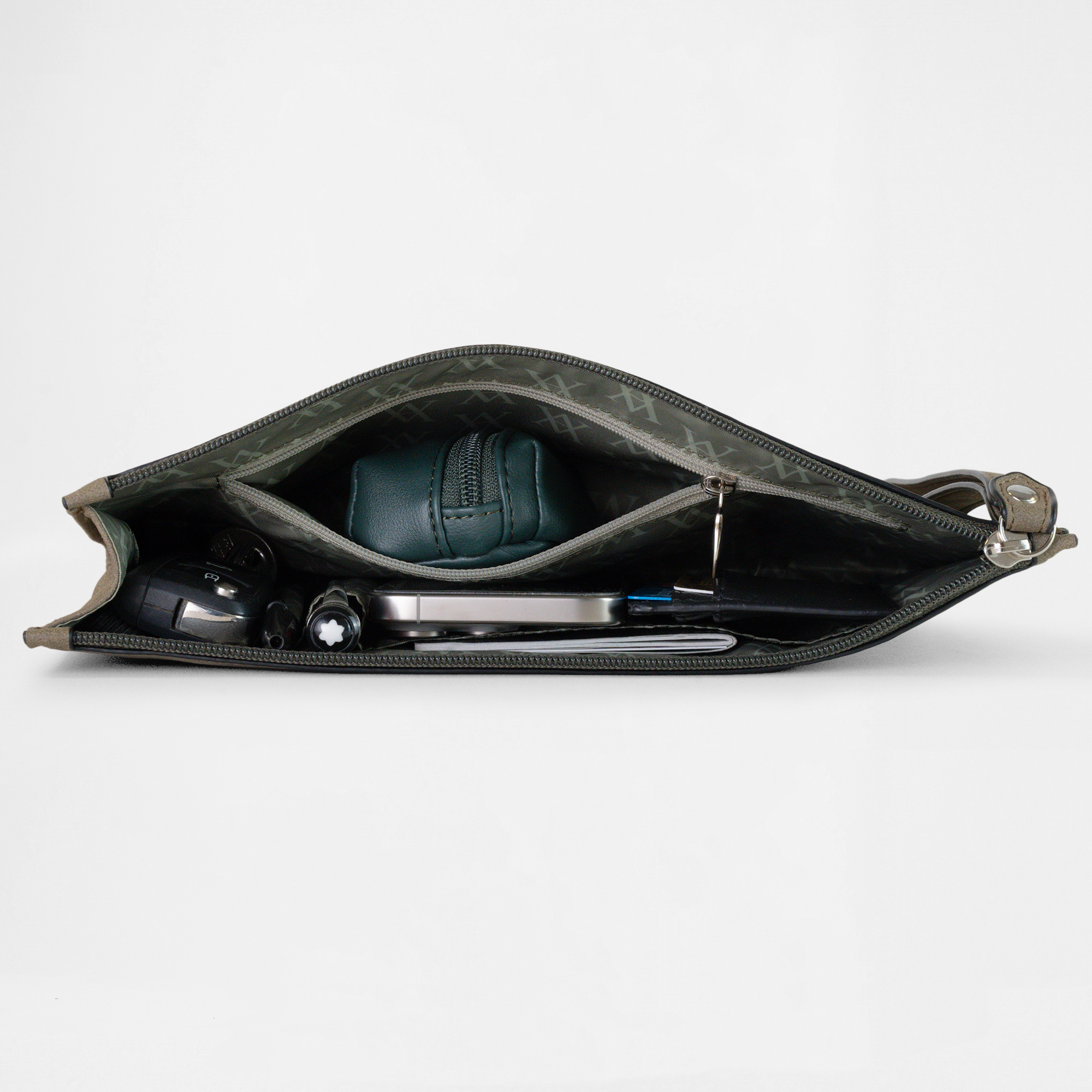Open view of the Geneva Compact Pouch in Olive Drab, neatly packed with travel accessories inside.