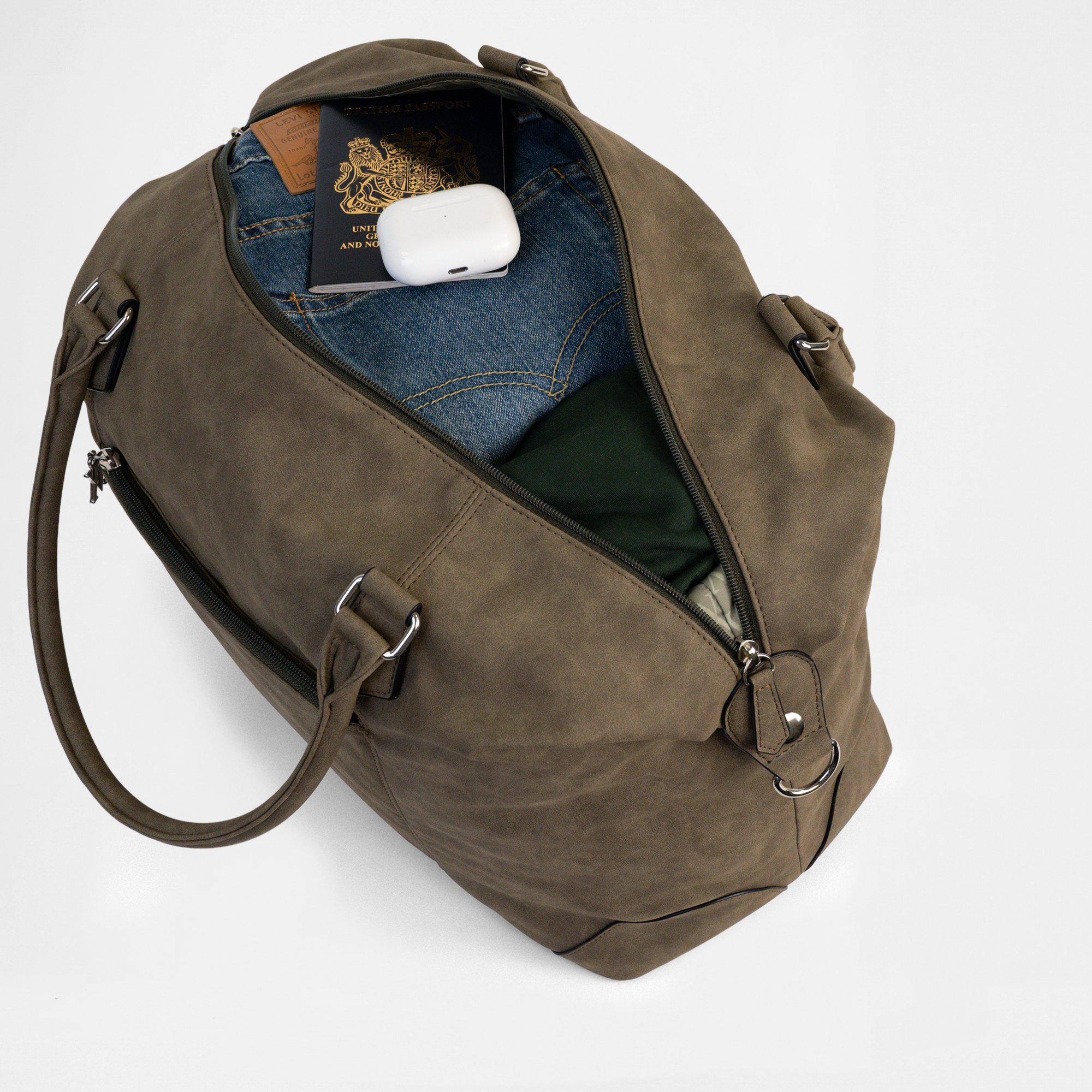 Open top view of the Lisbon Weekender in Olive Drab, packed with travel items including passport and AirPods.