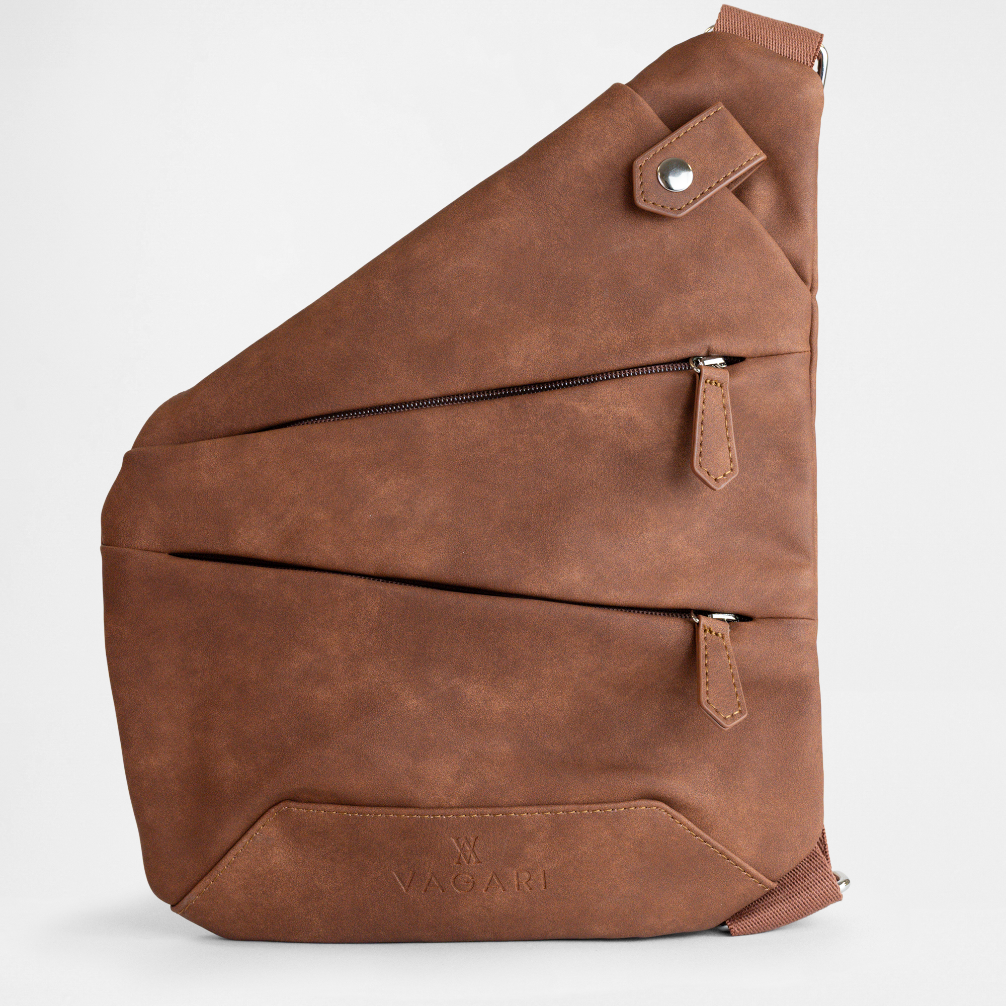 Front view of the London Sling Bag in Cognac displaying zipped compartments and phone pocket.